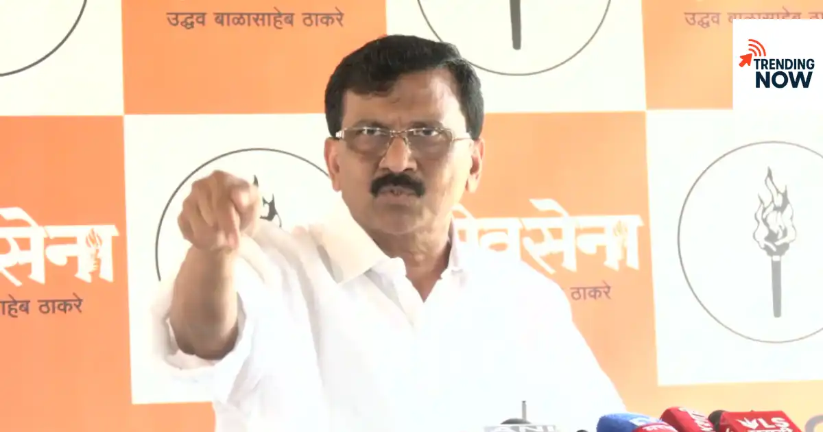 Shiv Sena (UBT) leader Sanjay Raut addressing a press conference while making a statement and pointing towards the audience.